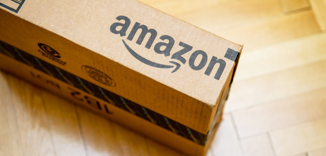 Amazon logotype printed on cardboard box © AdrianHancu/GettyImages